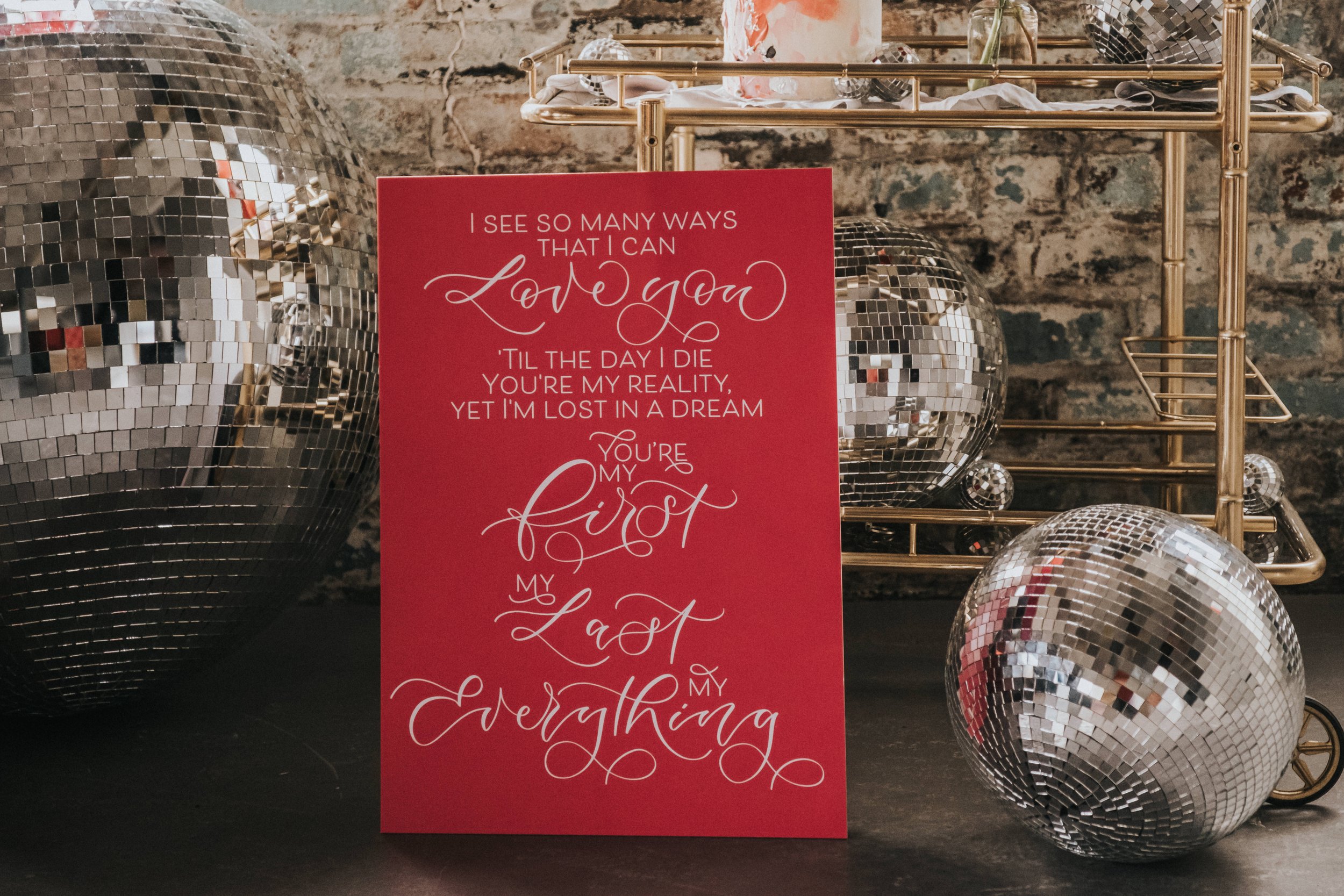 Disco themed wedding stationery with pink, black, grey and red colour scheme - disco ball wedding - calligraphy wedding signage and welcome sign - wedding sign with first dance lyrics.jpg