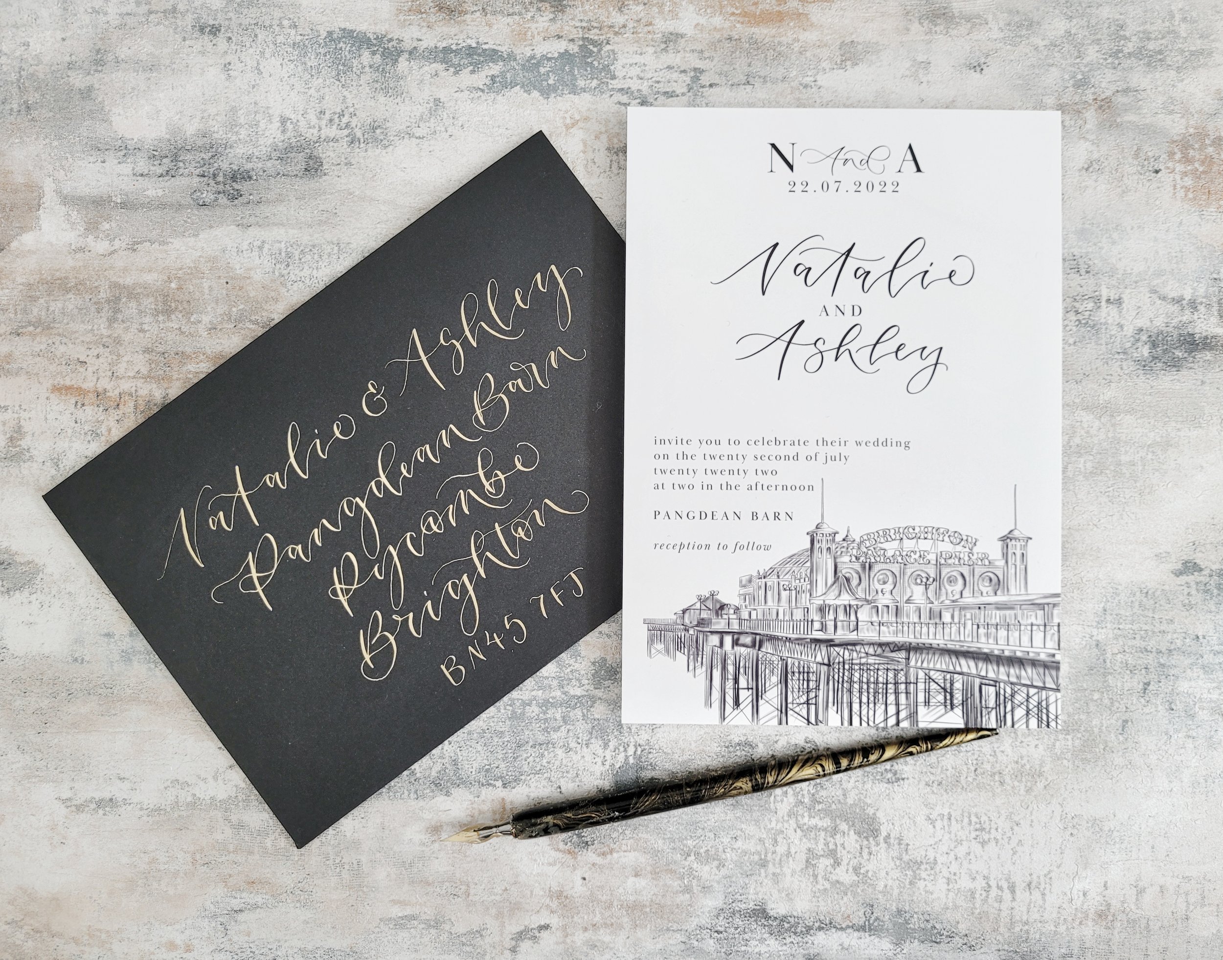 Brighton wedding stationery with pier illustration and modern calligraphy - monochrome minimalist invitation with black calligraphy envelope.jpeg