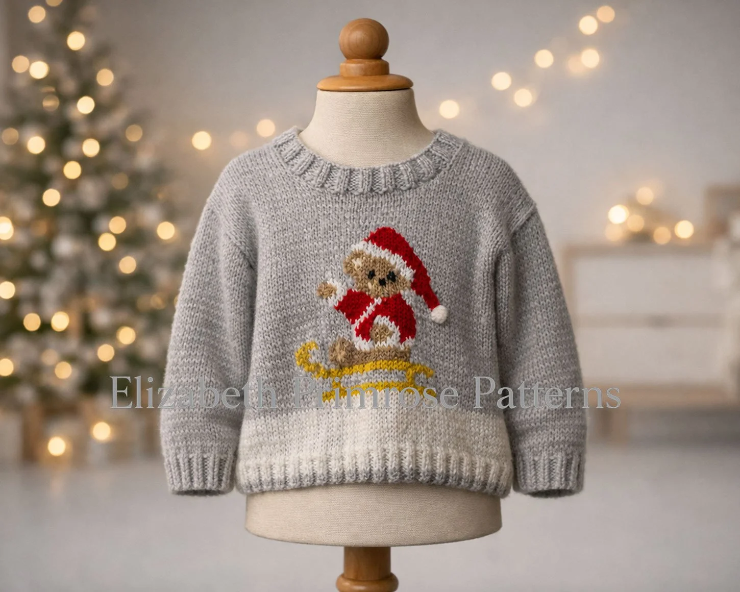 Hand knitted festive sweater featuring a teddy bear in a red Santa outfit, displayed on a mannequin with blurred holiday lights in the background.