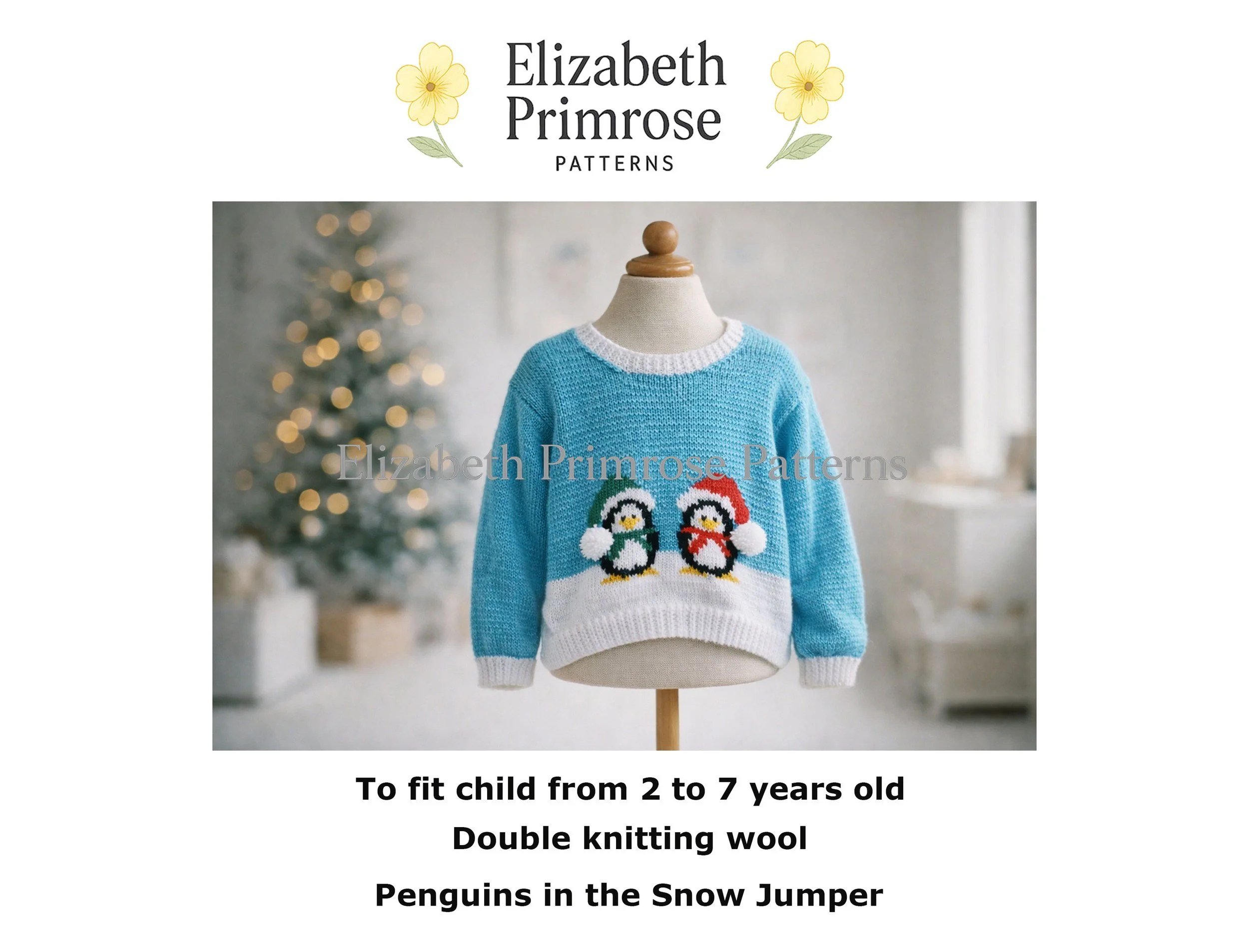 Blue children’s jumper with two penguins in winter hats, displayed on a mannequin against a softly blurred Christmas tree background.