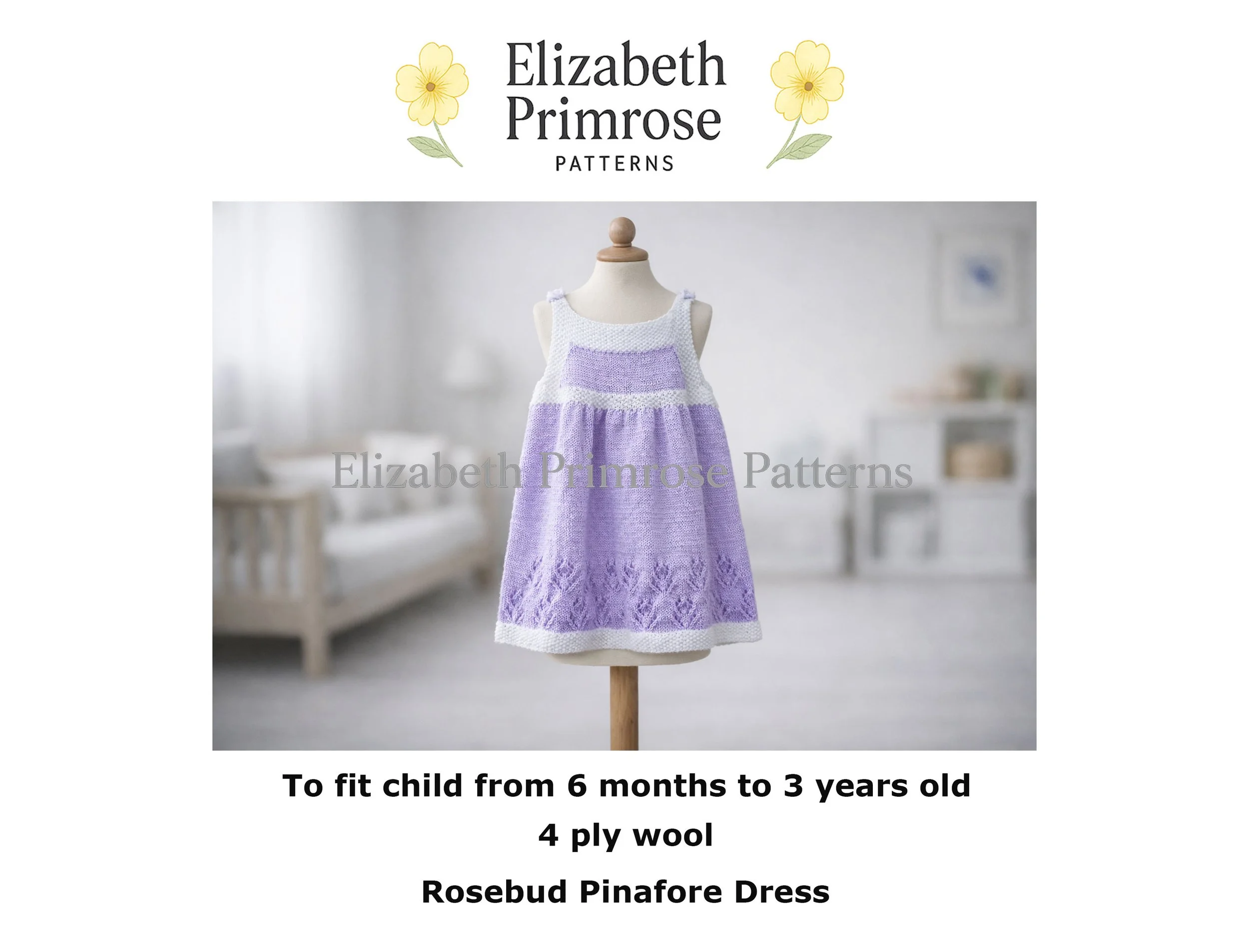 Hand‑knitted children’s pinafore dress in white and lavender displayed on a mannequin, featuring lace detailing and moss‑stitch edging in a soft, neutral room.
