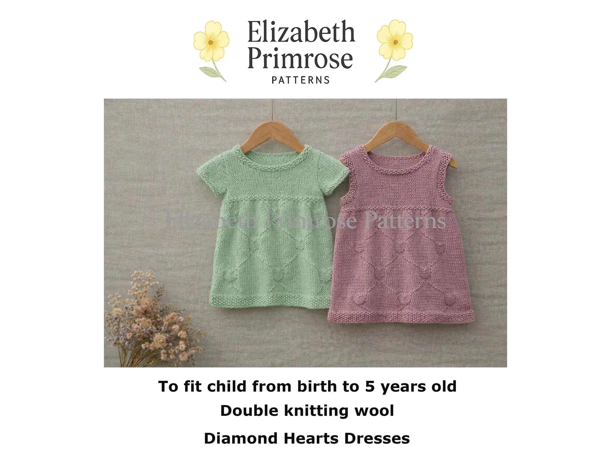Mint green short-sleeved and dusty pink sleeveless hand-knitted Diamond Hearts child dresses on wooden hangers.