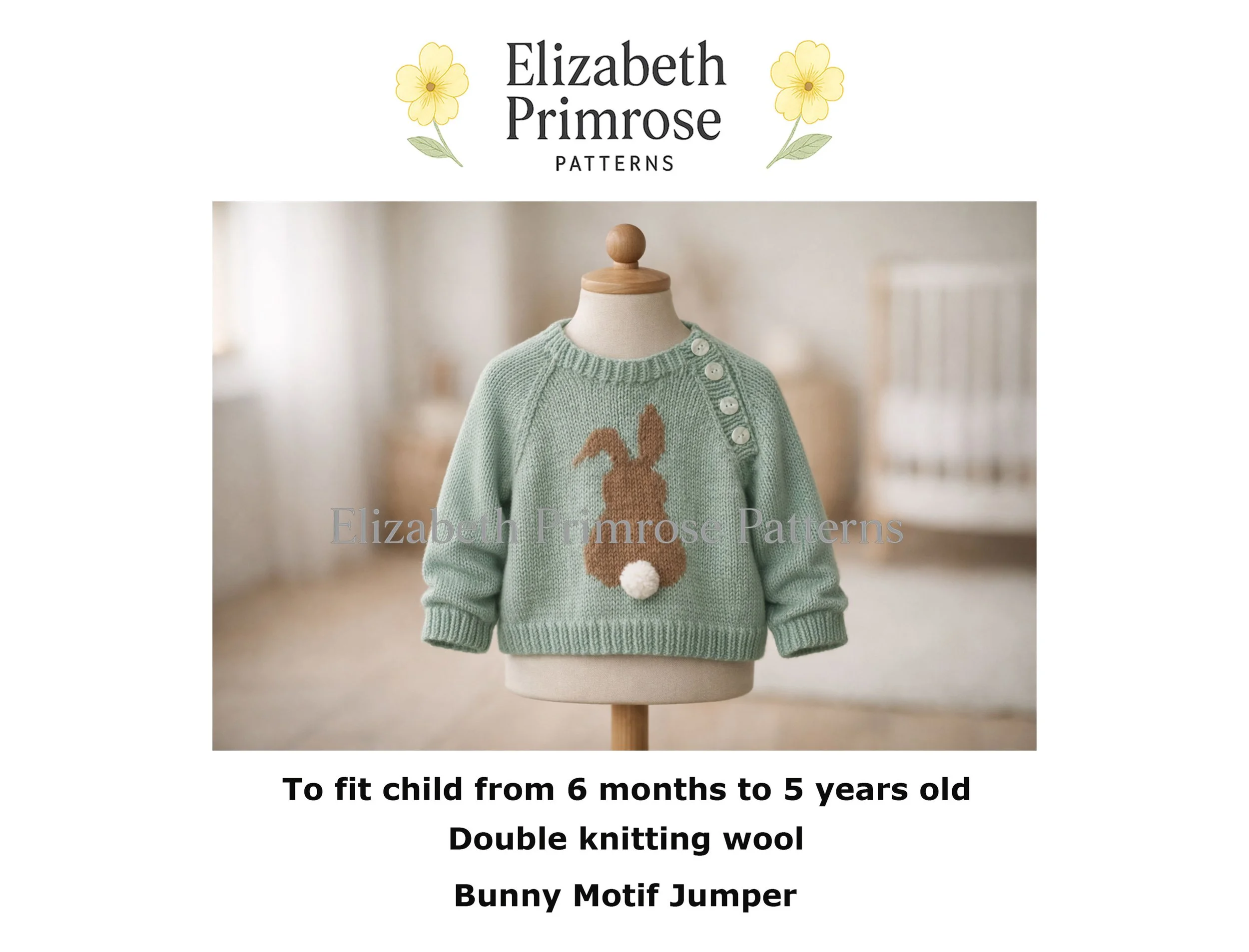 Light green hand‑knitted baby jumper with brown bunny motif and white pom‑pom tail, displayed on wooden‑topped mannequin in softly lit Scandinavian nursery.