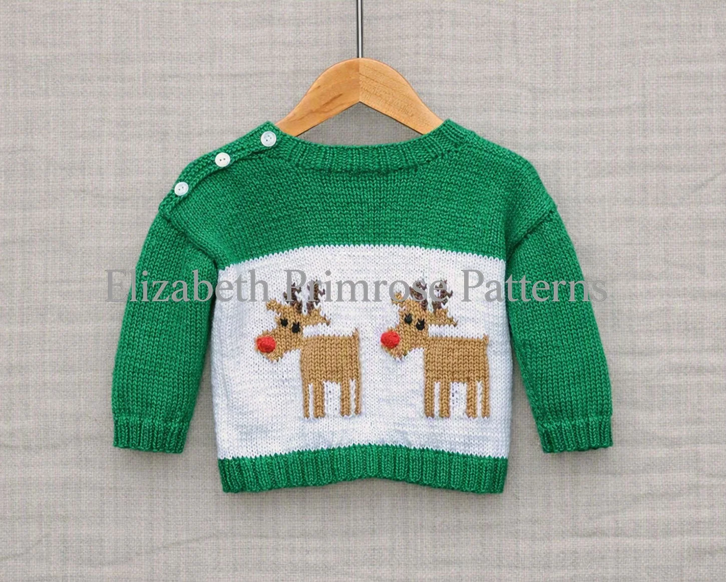 Green Christmas jumper featuring two red nosed reindeers, shown from the back view, on a hanger against a fabric background.