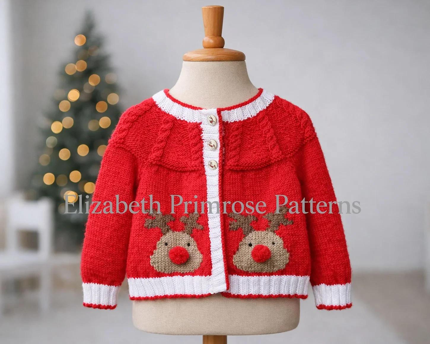 Knitted red reindeer motif children’s jacket displayed on a mannequin, crisp stitches in focus against a softly blurred minimalist Christmas room background.