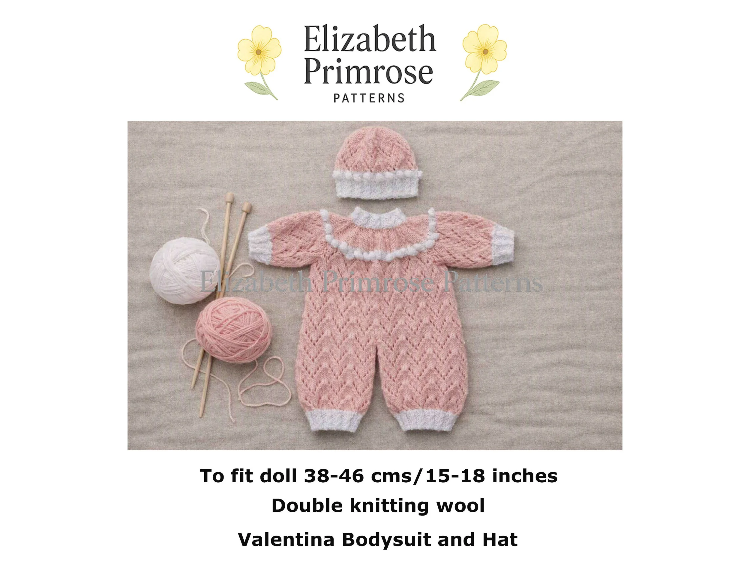 Pink hand-knitted doll romper with white lace yoke, matching hat, straight knitting needles, and yarn balls on a neutral background.