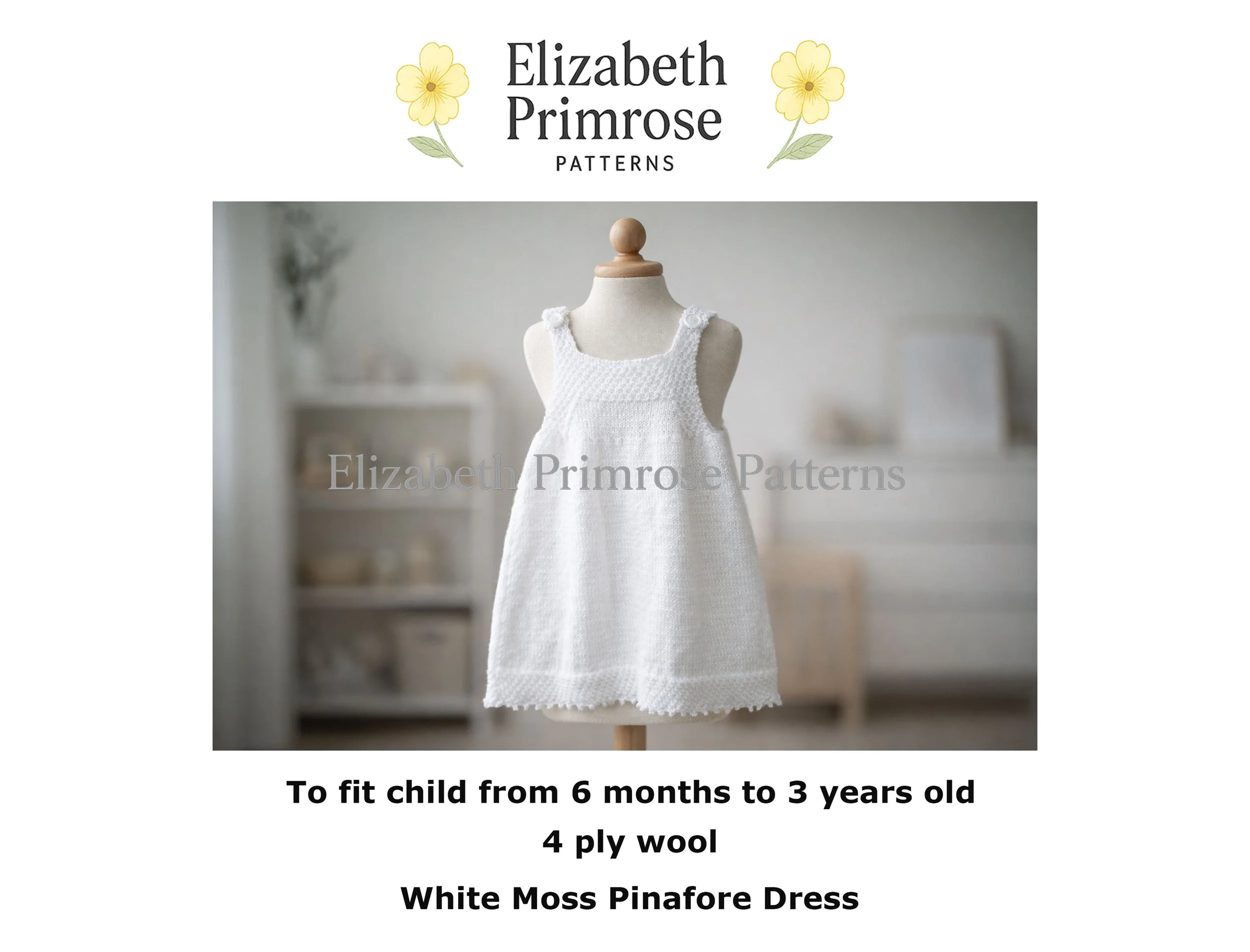 White hand knitted children’s pinafore on a fabric mannequin with buttoned straps, textured bodice and smooth skirt, shown in a softly blurred Scandinavian nursery.