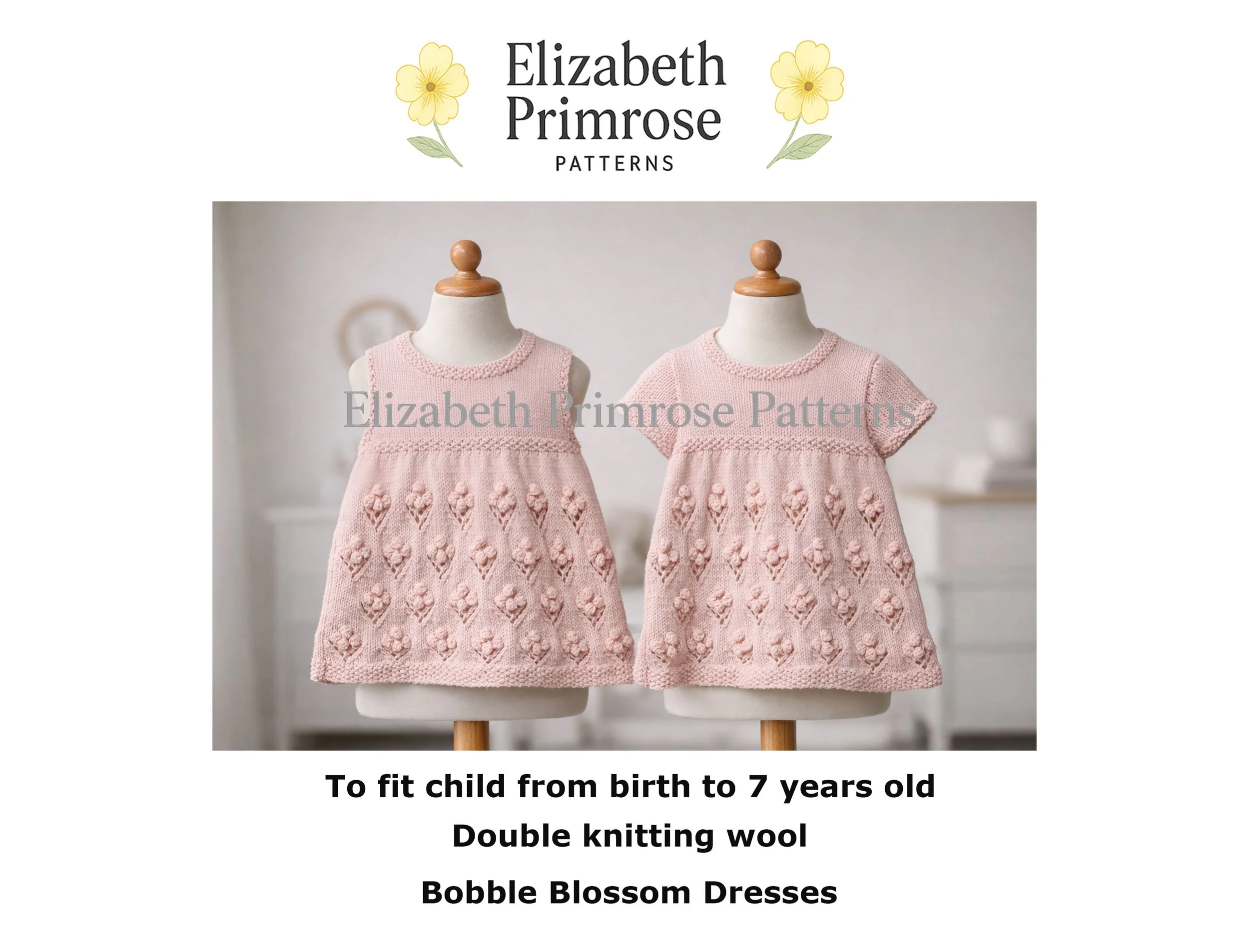 Light pink hand knitted children’s dresses displayed on mannequins, one sleeveless and one short sleeved, featuring a textured bobble flower skirt pattern in a softly lit studio setting.