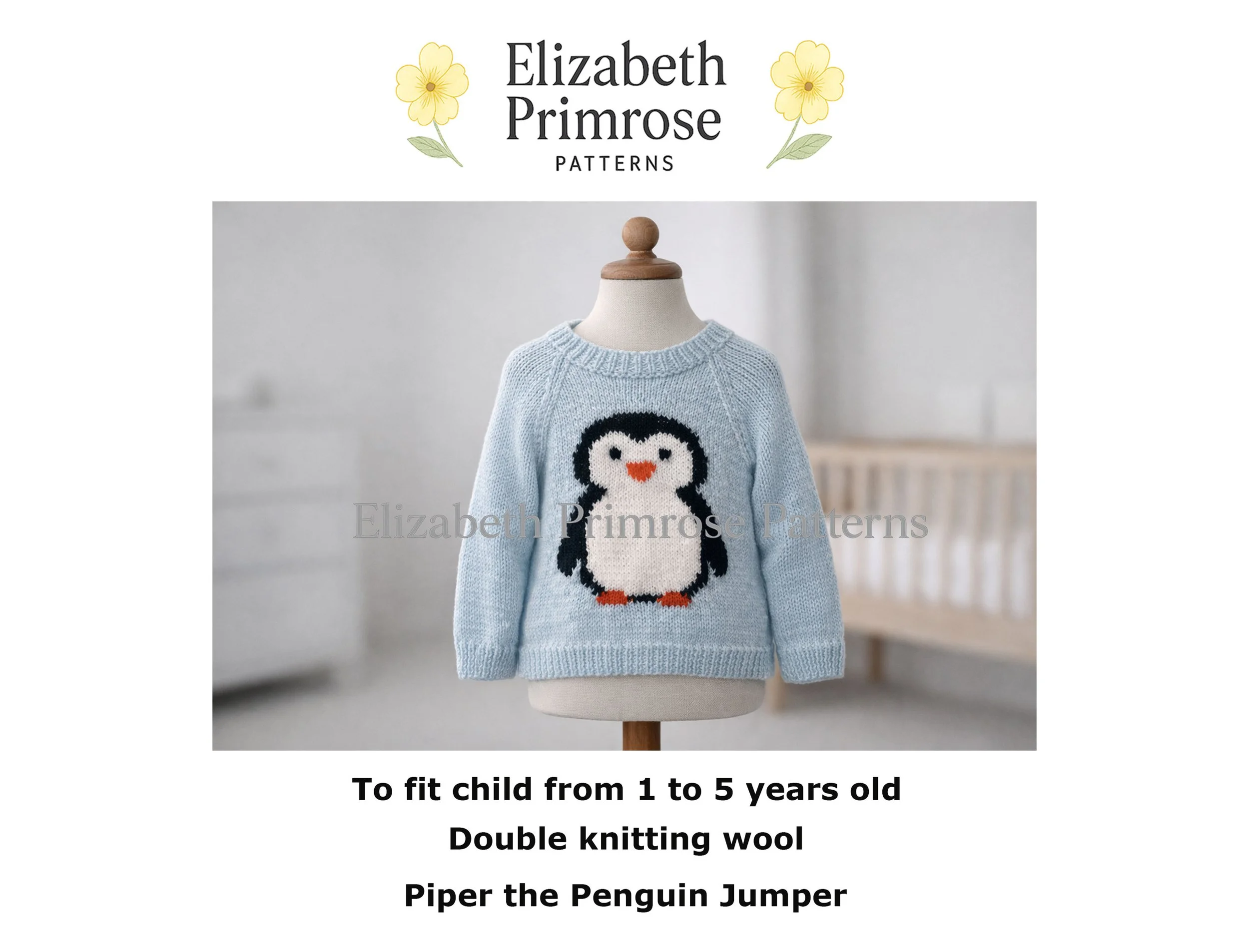 Light blue children’s jumper with a penguin motif displayed on a fabric mannequin in a softly lit nursery setting.