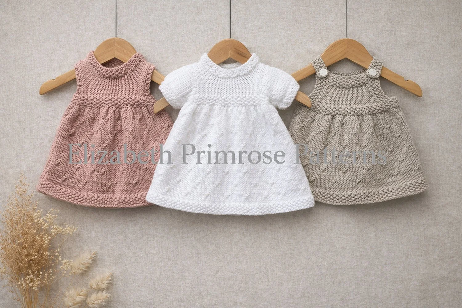 Three knitted doll dresses displayed side by side on wooden hangers, featuring textured patterns, soft colours, and gentle gathered hems.