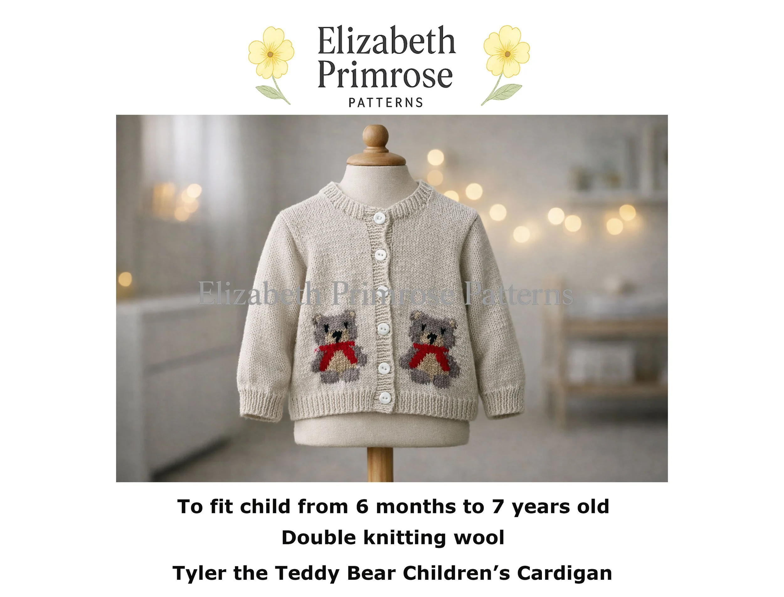 Hand‑knitted beige baby cardigan with two teddy bear motifs and red scarves, displayed on a child mannequin with visible fabric torso and wooden stand in a softly lit Scandinavian room.