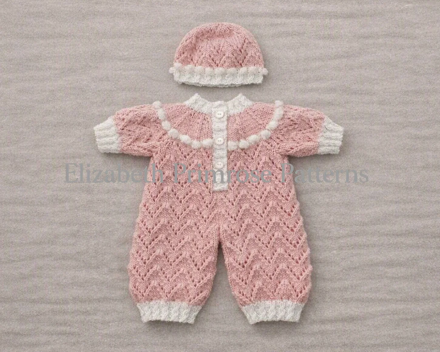 Back view of pink hand-knitted doll romper showing button closures along the white yoke, shown next to a matching pink hat with a white ribbed brim.