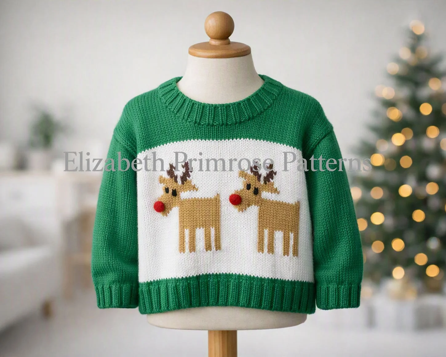 Children’s green knitted reindeer jumper on mannequin, softly lit Scandinavian Christmas room background with blurred tree and fairy lights.
