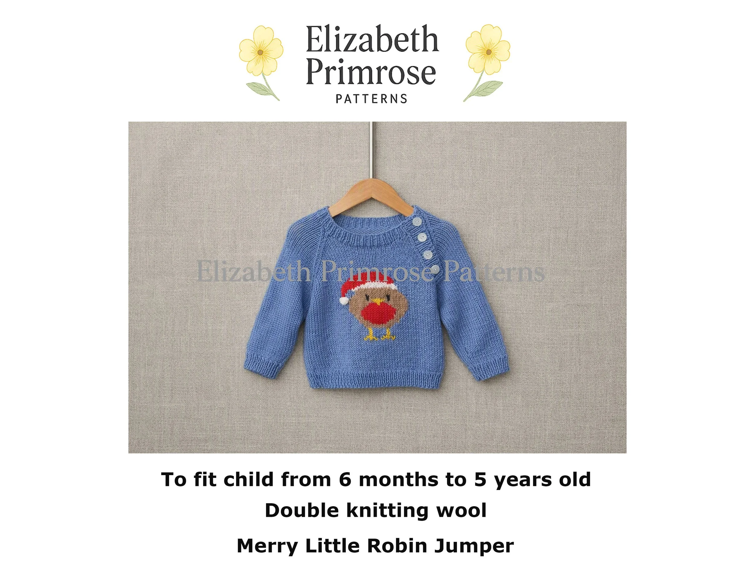 Blue baby jumper with Christmas robin motif hanging on a wooden hanger against a neutral fabric background.