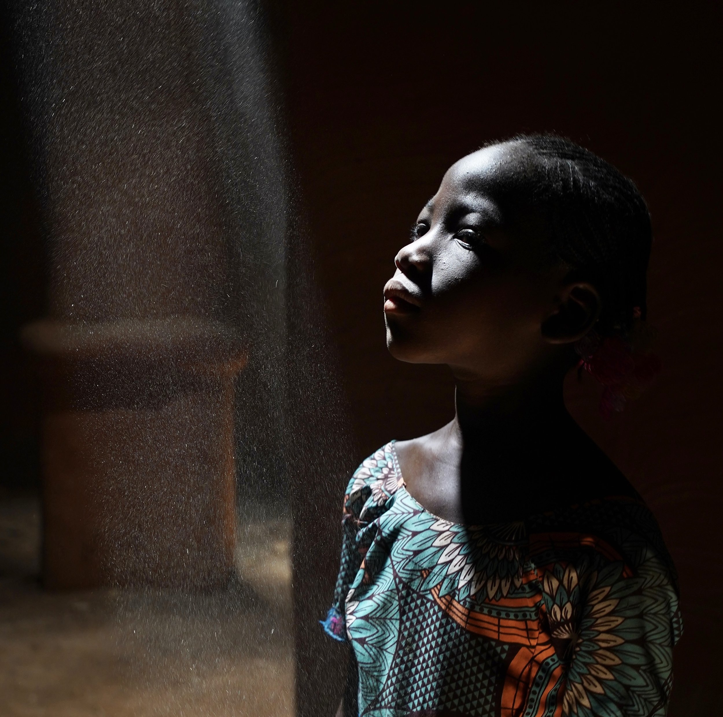 Caught in a shaft of light in an ancient palace in Mali