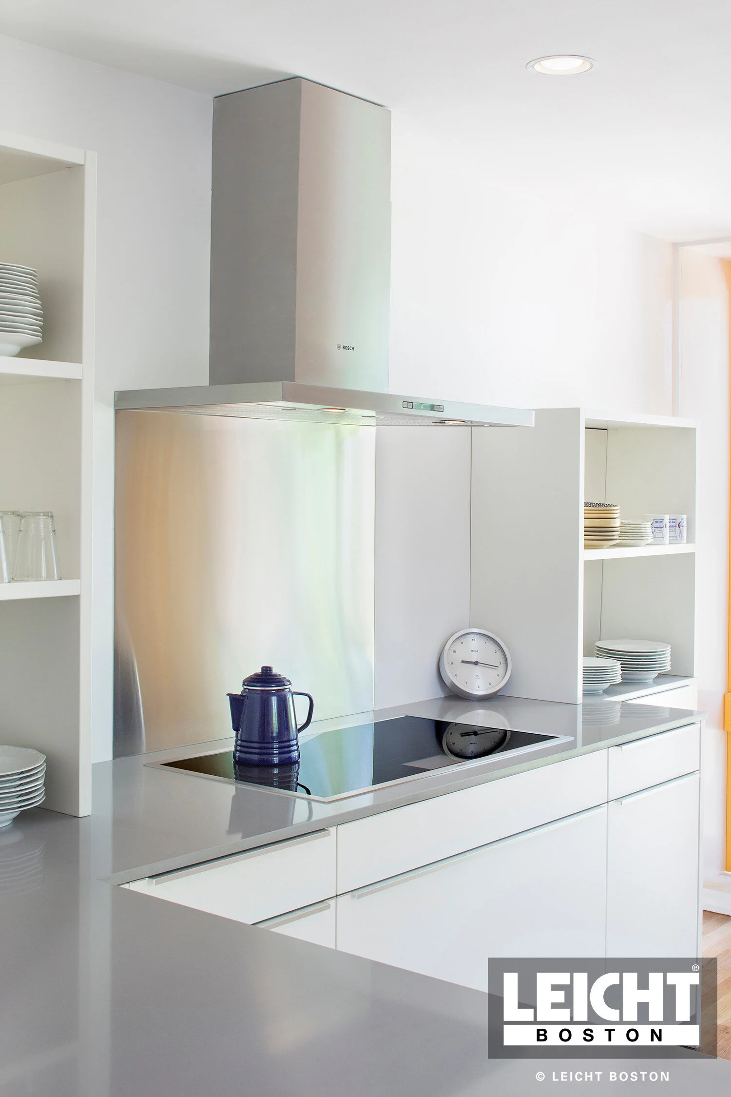  Leicht modern kitchen with Gaggenau appliances and cambria brittanica countertop. Handleless white cabinets with grey channels. Open shelving. 