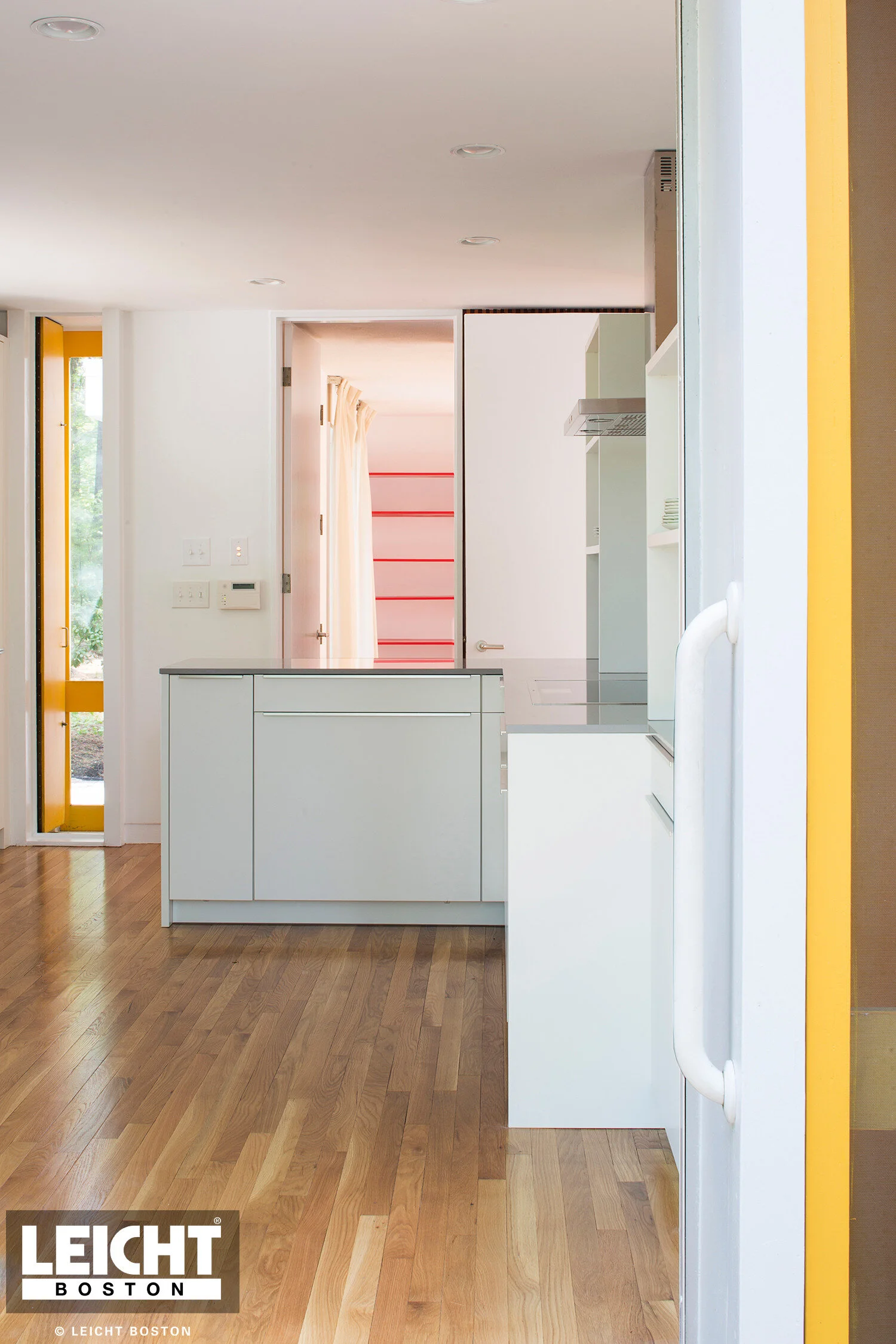  Leicht modern kitchen with Gaggenau appliances and cambria brittanica countertop. Handleless white cabinets with grey channels. Open shelving. 