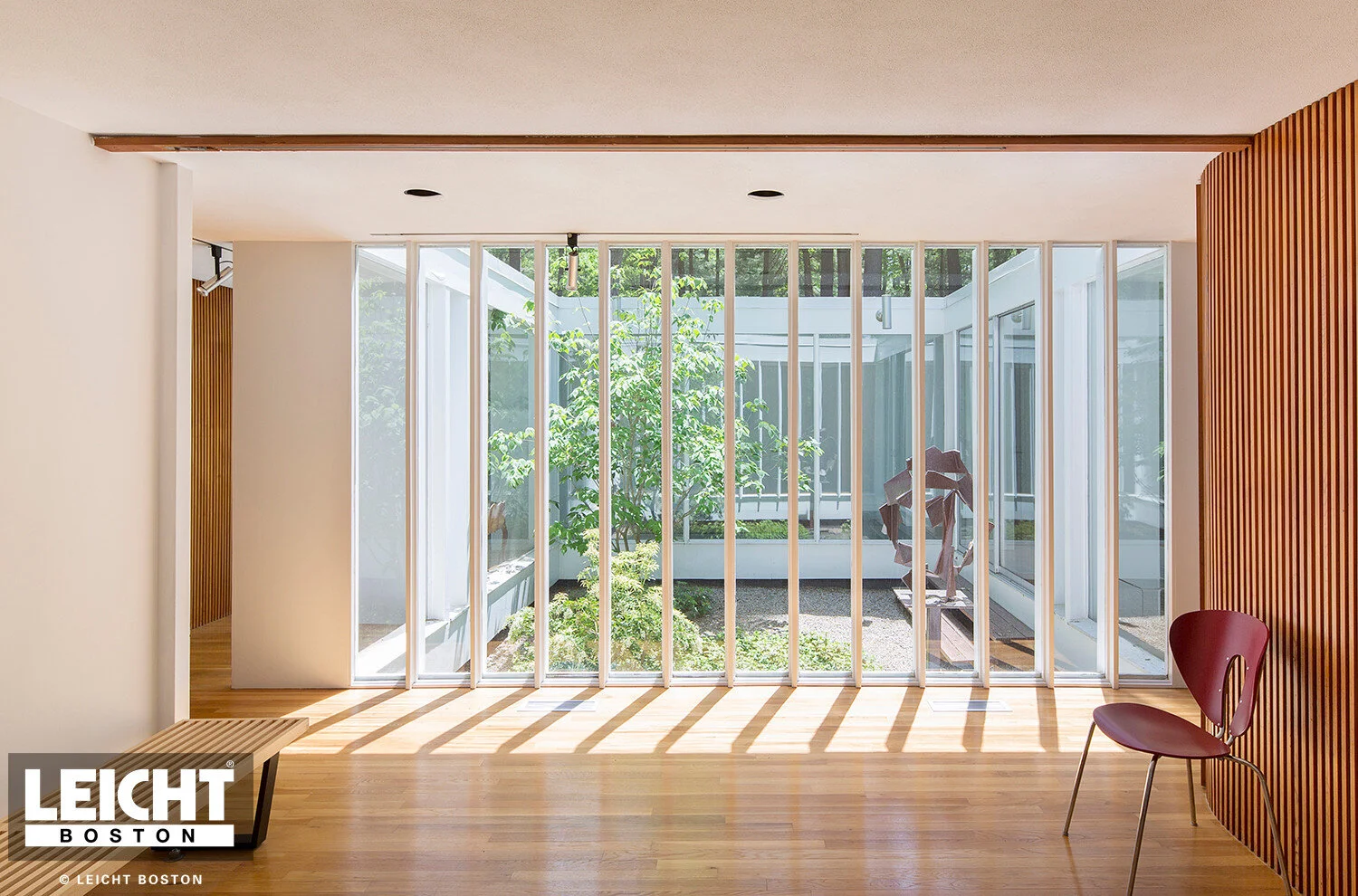  Interior of home open courtyard with garden. Hardwood floors and mid century modern accents.