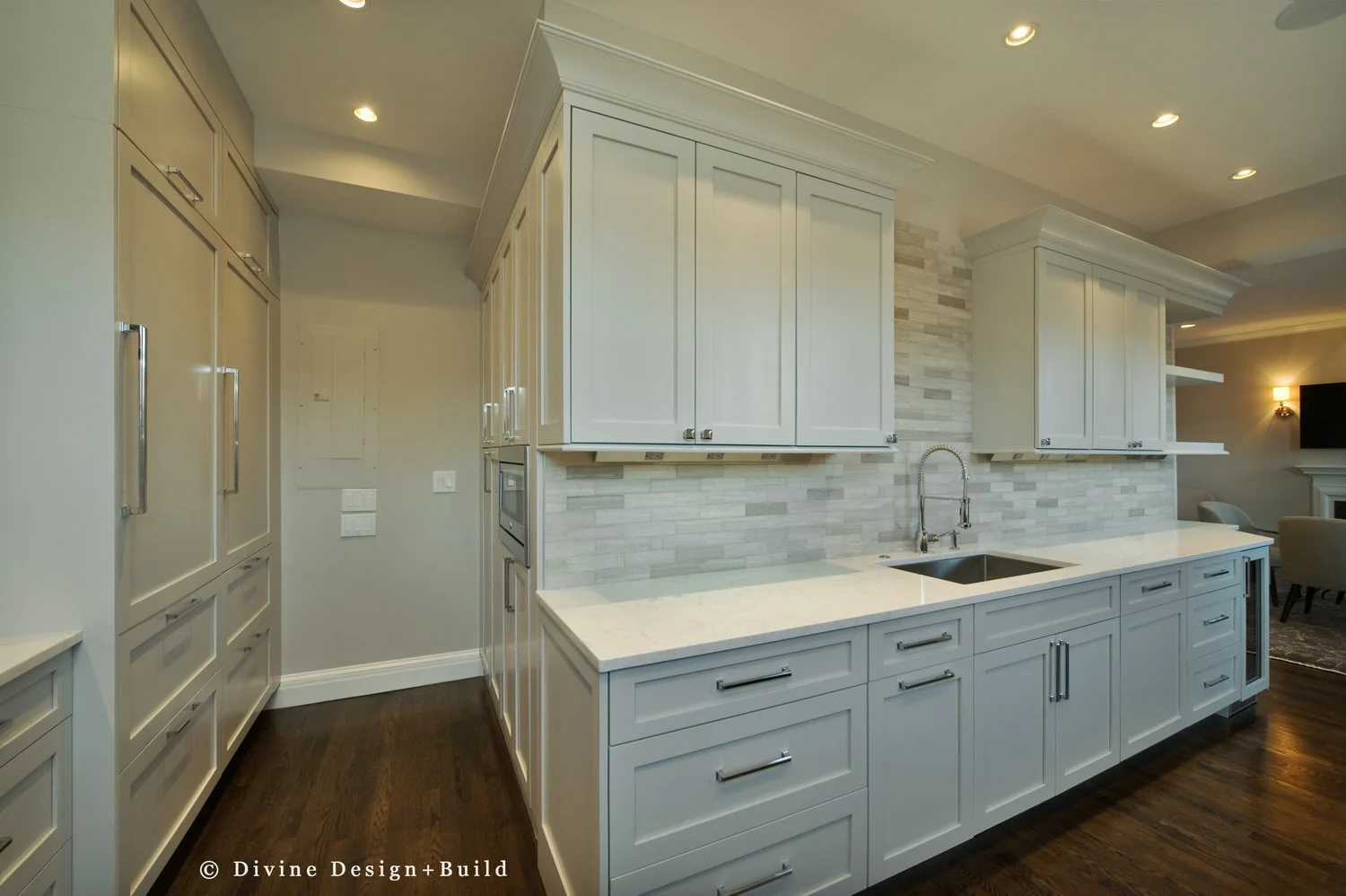  Dark hardwood floors, off white shaker style cabinets with pewter pulls. Mosaic subway tile backsplash. Wolf appliances, and open shelving