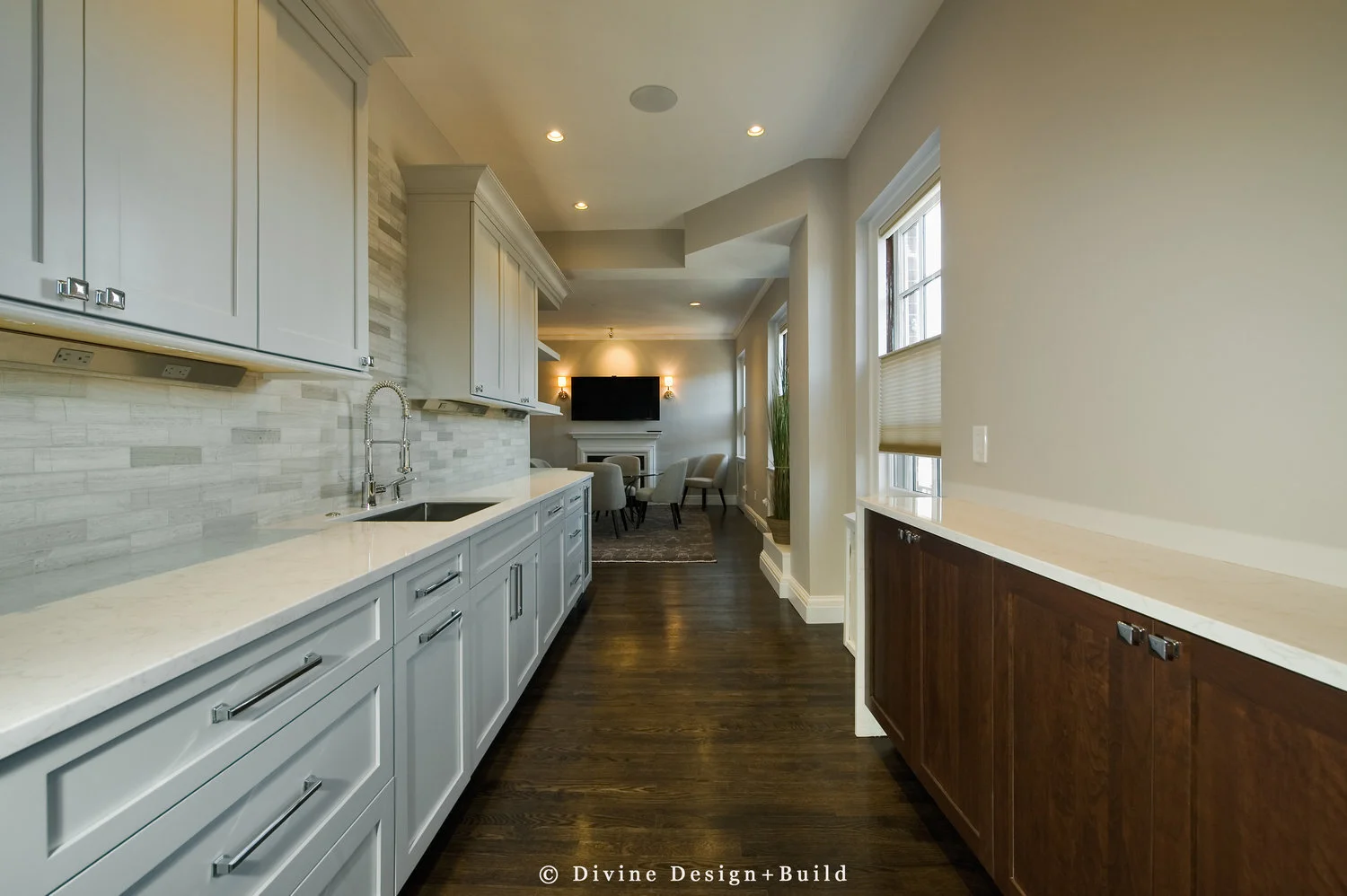  Dark hardwood floors, off white shaker style cabinets with pewter pulls. Mosaic subway tile backsplash. Wolf appliances, and open shelving