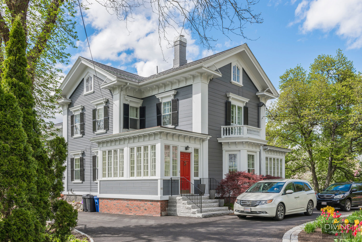  Lexington Queen Anne style single family home with blue wood siding, white moldings. 