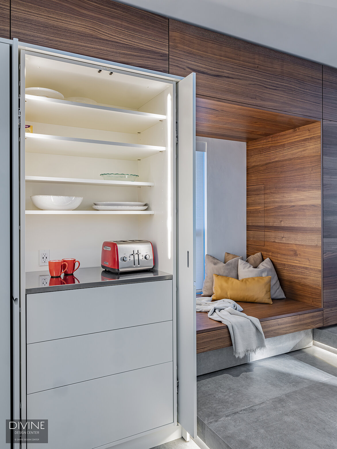  Hidden, white niche shelving and interior lighting for extra kitchen storage by Leicht.  