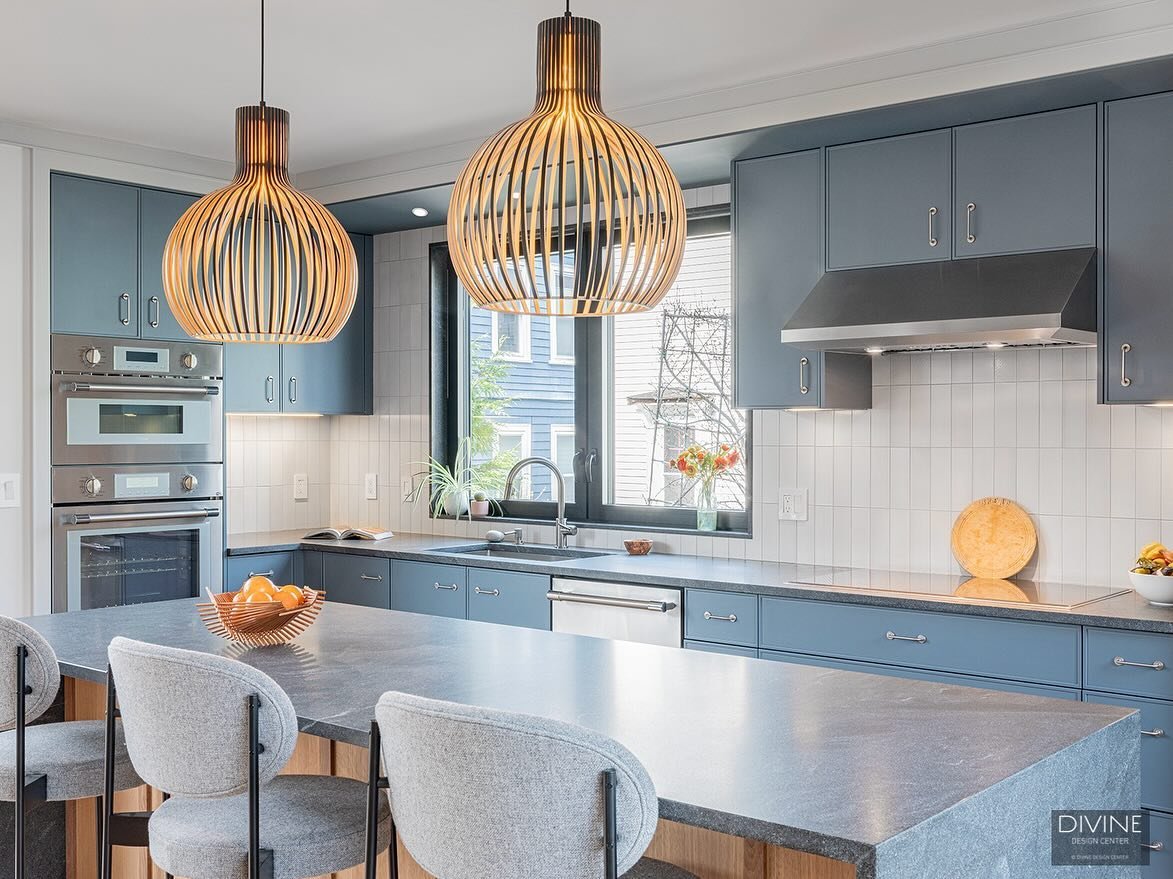 Our newest kitchen project in Cambridge has a timeless visual appeal that homeowners and houseguests alike will never tire of. From the slightly subdued blue to the white vertical tile backsplash and warm diagonal hardwood flooring, every detail is i