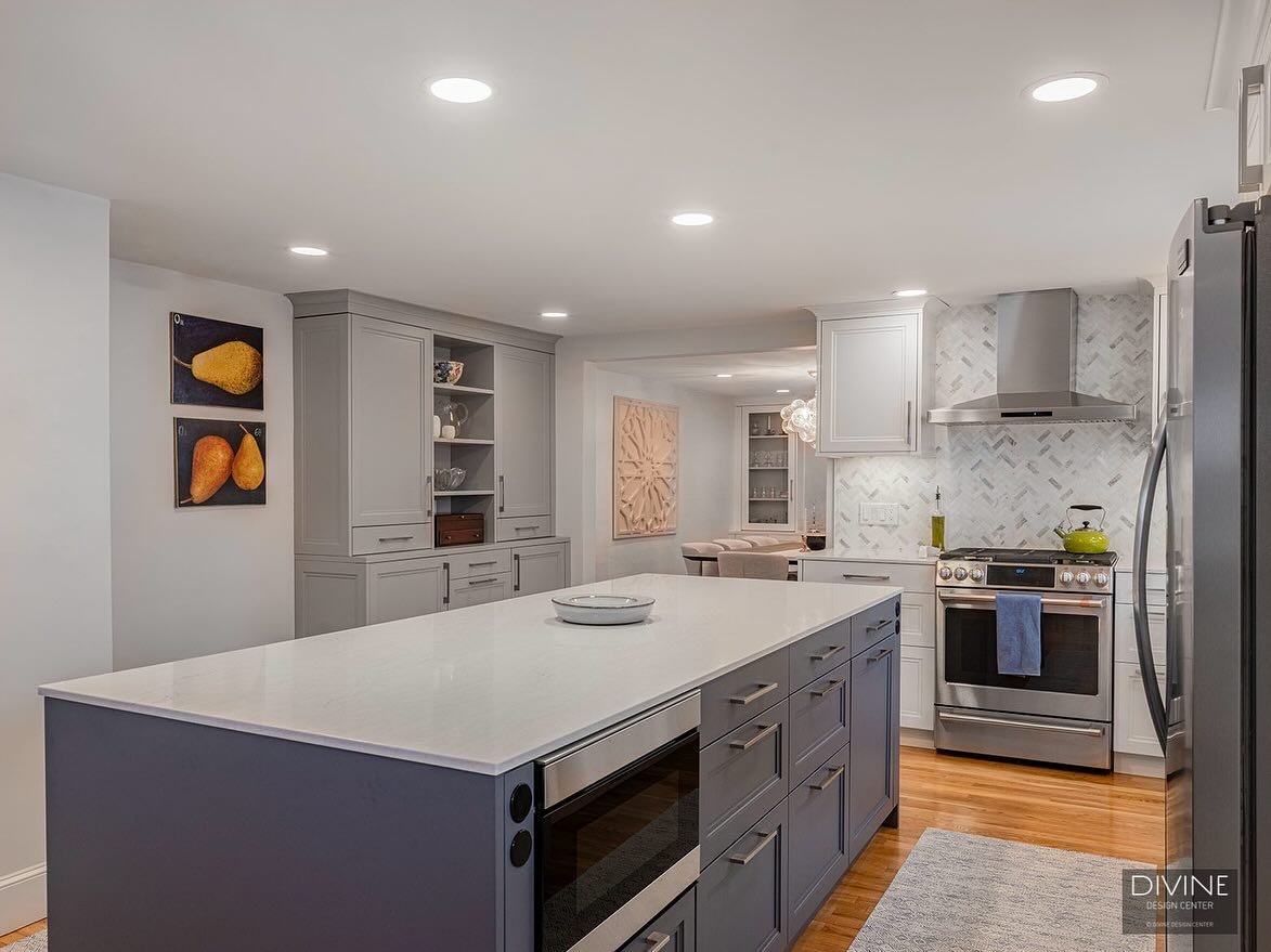 Built for entertaining, this transitional kitchen &amp; expansive island with bar seating is located adjacent to a warm and inviting dining room boasting plenty of built-in cabinetry storage. Connecting the two spaces is a built-in hutch which serves