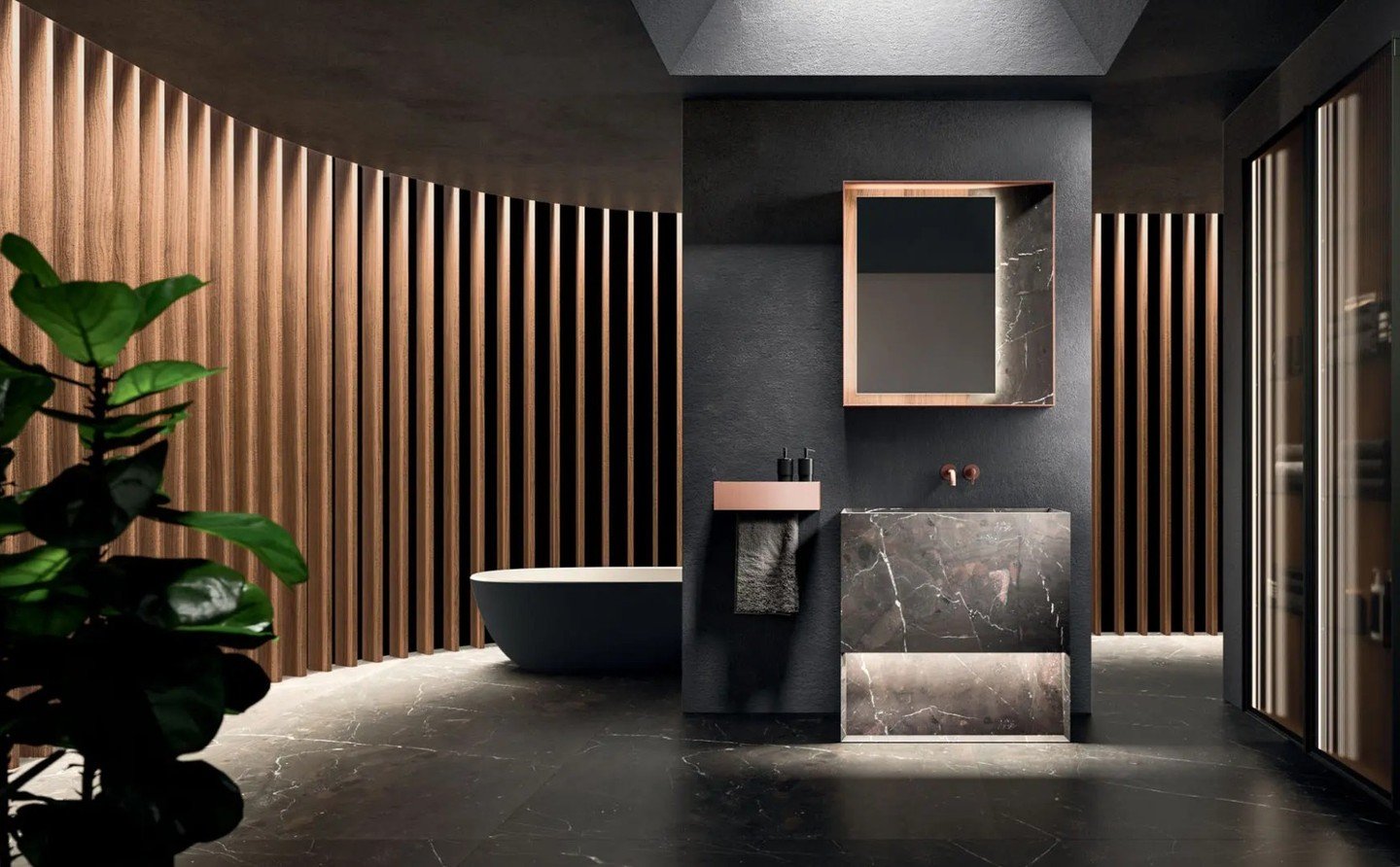 The #MUST collection by @arrital redefines the bathroom through a subtle balance of textures. By pairing a structural metal frame with the organic depth of Taj Mahal Satin quartzite and Thermo-treated Eucalyptus, the space transcends function. Here, 