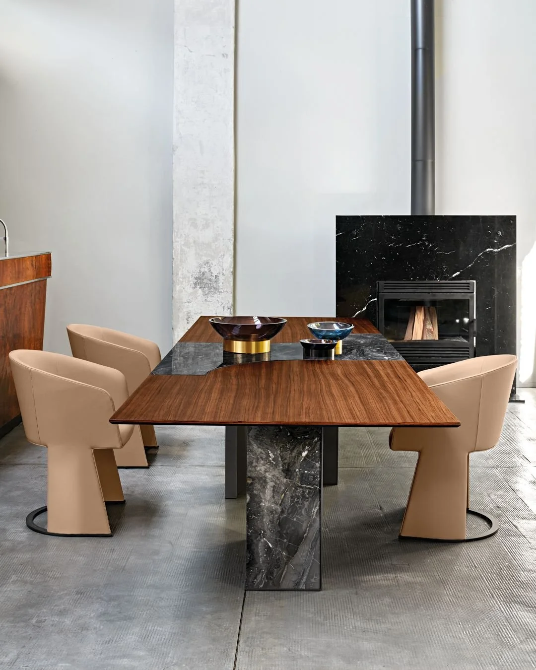 Defined by contrast and clarity, the Millennium table channels a refined architectural language into everyday living &mdash; by @arketipofirenze. A generous wooden surface is punctuated by a precise marble inlay, introducing rhythm and tension betwee