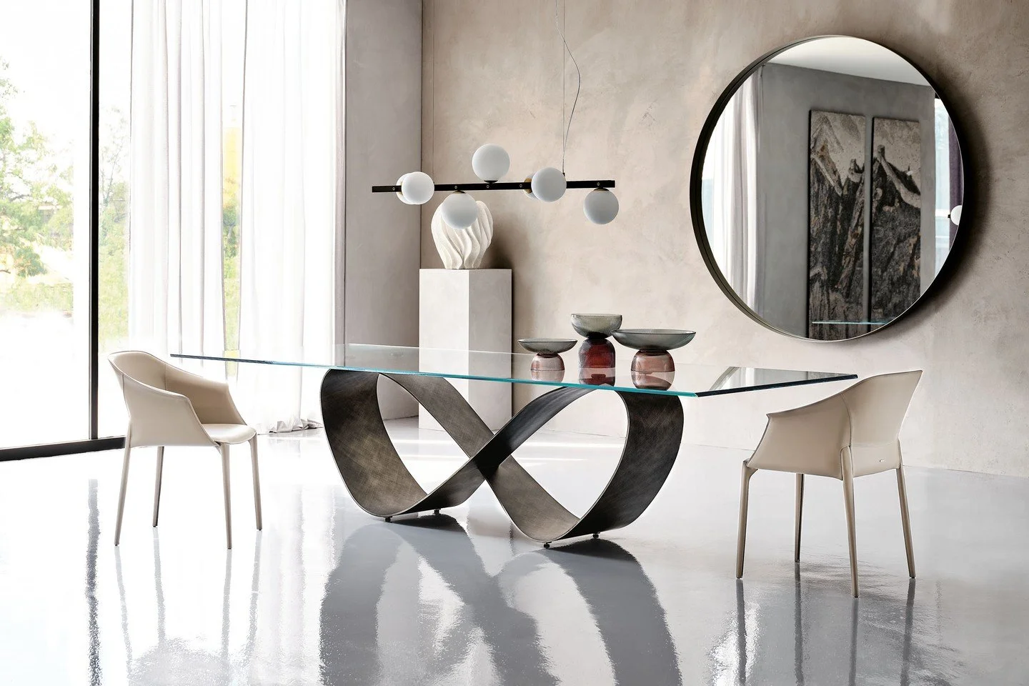 The Butterfly table by @cattelanitalia pairs a boldly sculpted base &mdash; available in titanium or bronze lacquered finish &mdash; with a glass top so delicate it seems to simply float above. The contrast is deliberate. The result is unforgettable.