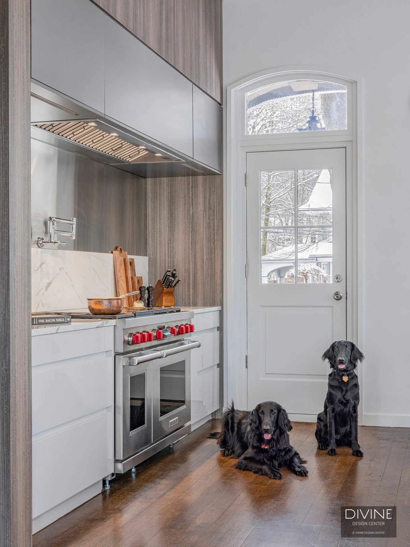 Step through the stone entrance and into something extraordinary. This Newton, MA kitchen blends modern Italian cabinetry, rich wood tones, and Wolf professional appliances into a space that's equal parts chef's kitchen and showpiece.

The details &m