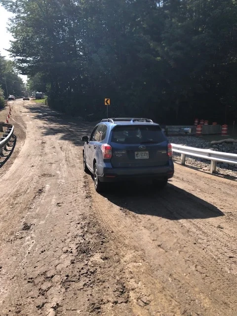 Dorothy Heinrichs drives across the new bridge. Paving comes later. And don’t forget, culvert work could cause 15-minute delays starting Monday from 8 to 4.