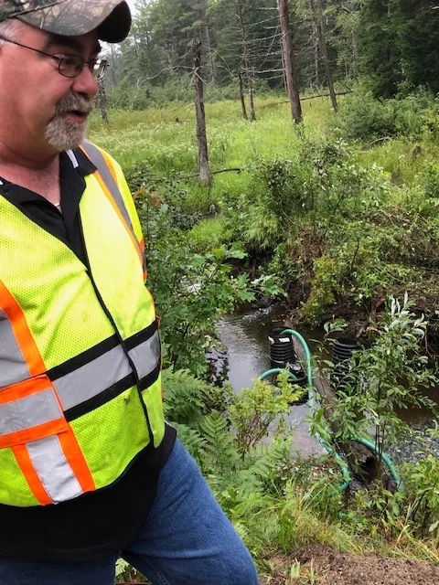 Pumps suck the water out of the ditch near Tuttle Hill Road. Yesterday’s rains overwhelmed the system.