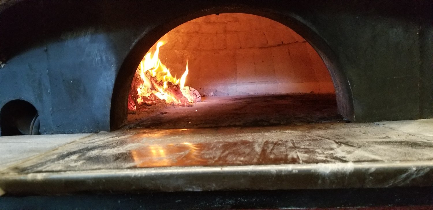 Wood burning oven- the secret to authentic pizza.