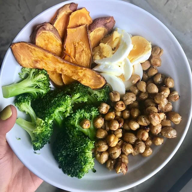 I call this meal &ldquo;I finally went grocery shopping and got way too excited to cook so I just made a little of everything&rdquo; 👀 roasted chickpeas with some EBTB seasoning from @traderjoes along with some sweet potatoes @425 for 25ish mins, st