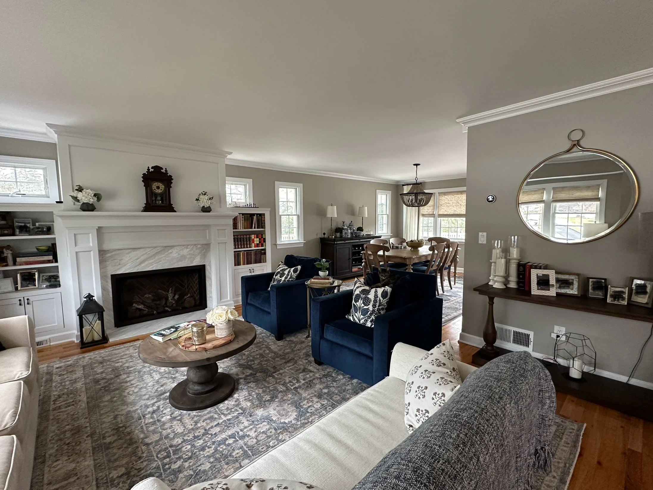 Windows were added above custom cabinets, which accentuates the new gas fireplace. The marble surround and new mantel add a focal point to the room. 
