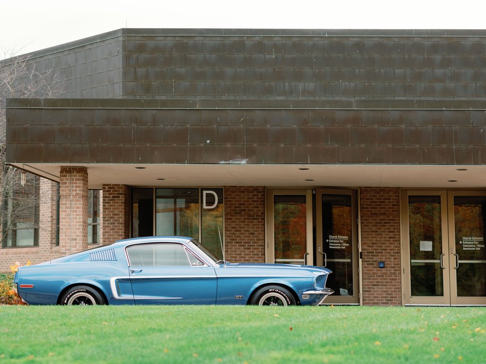 Vintage Mustang Parked Outside of Catholic Church