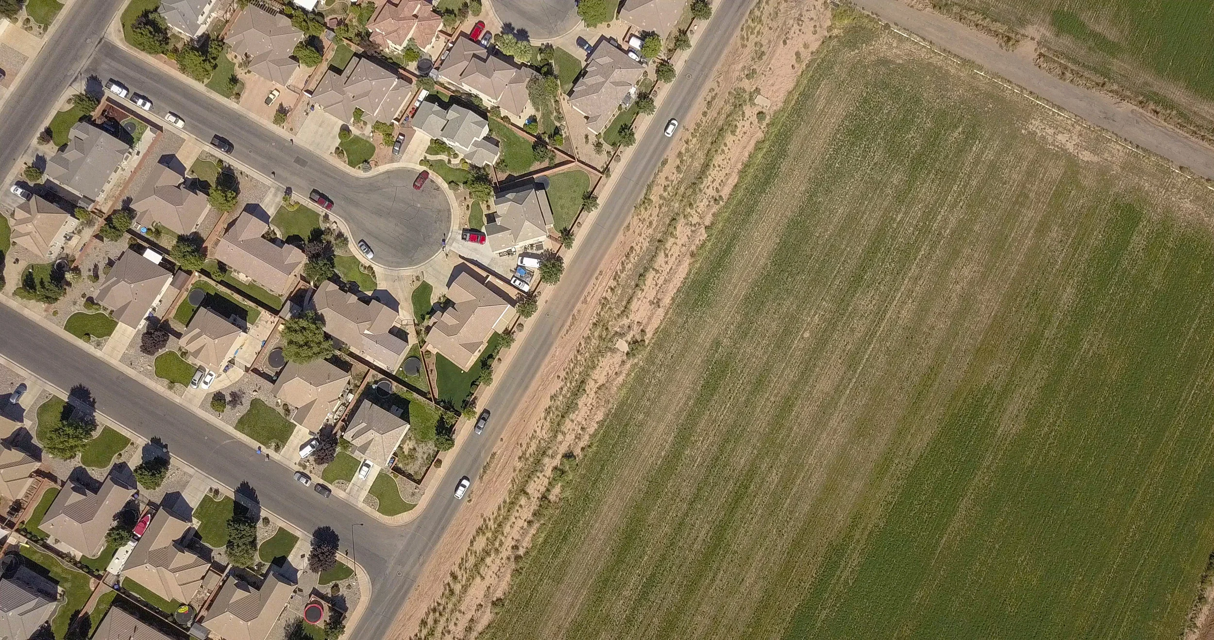 Irrigated farmland is being replaced by homes, strip malls, streets and parking lots which use much less water or no water whatsoever.