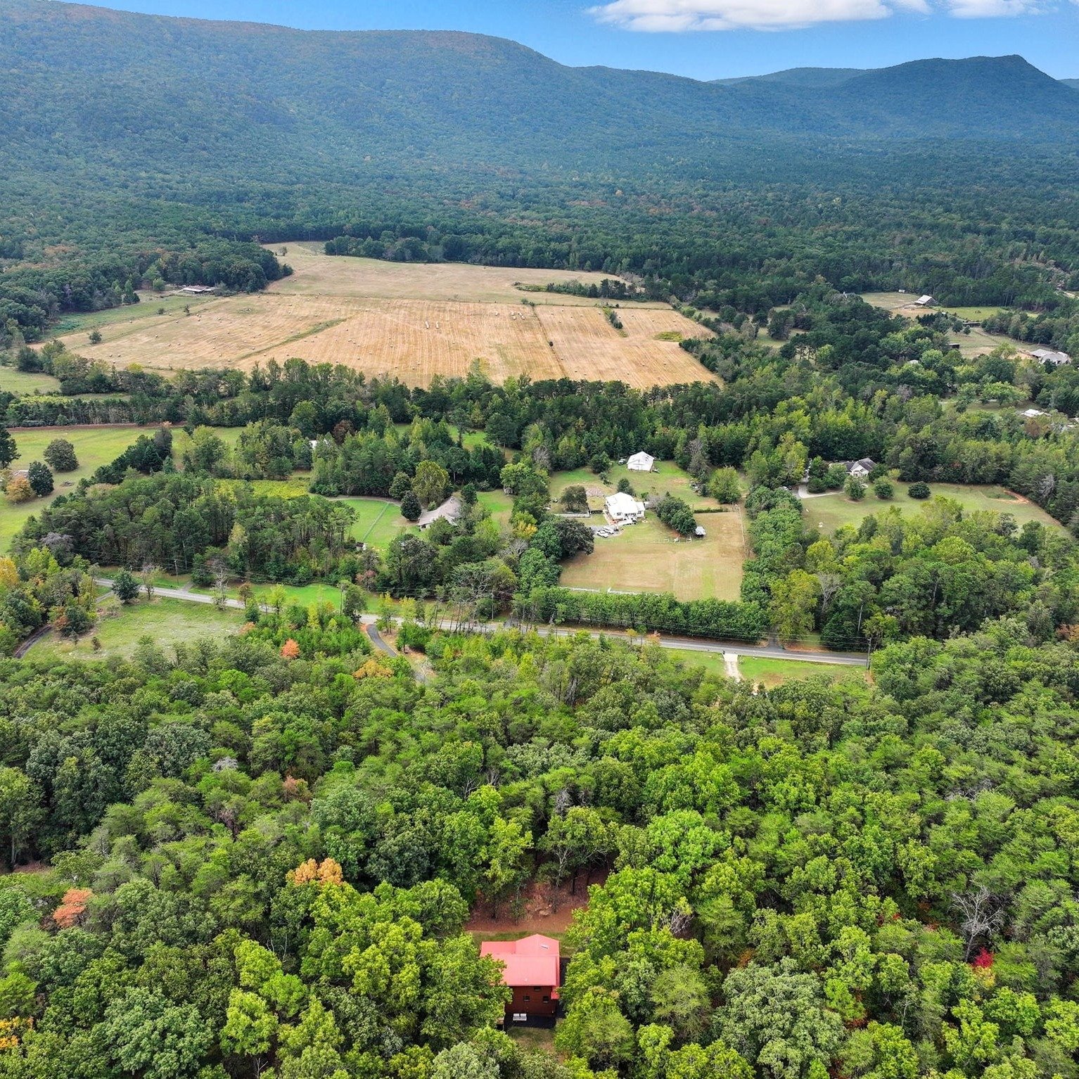 Open spaces made for everyday living
Privacy is the first impression, space is what follows.

Set on nearly 5 wooded acres, this Rydal GA log cabin for sale delivers true North Georgia seclusion with gated entry, long private driveway, and natural mo