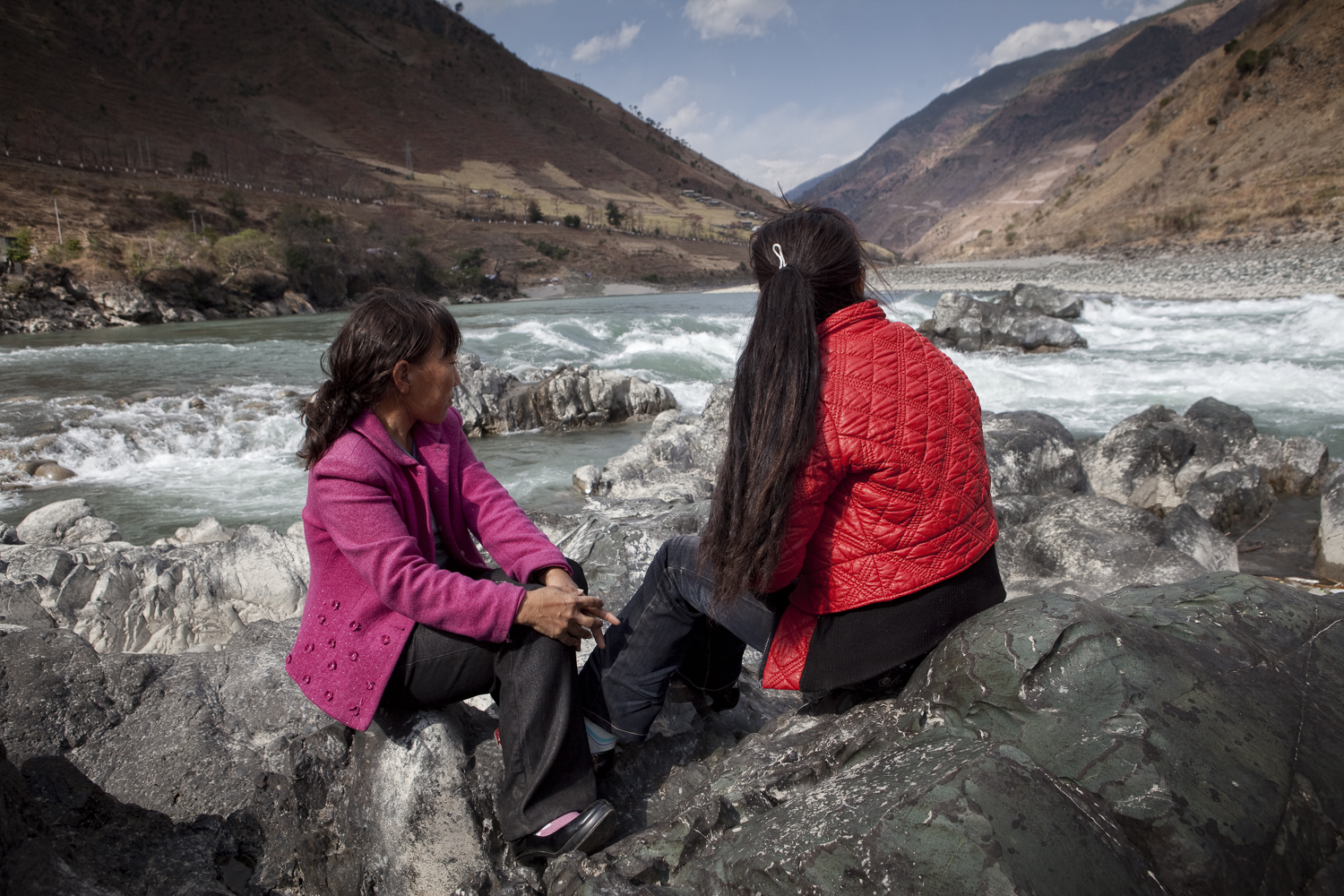  This site just north of Liuku is in the catchment of what might be another large dam along the river. These two women are from the only relocated village. When the dams were still being built their village was relocated off the river to new town awa