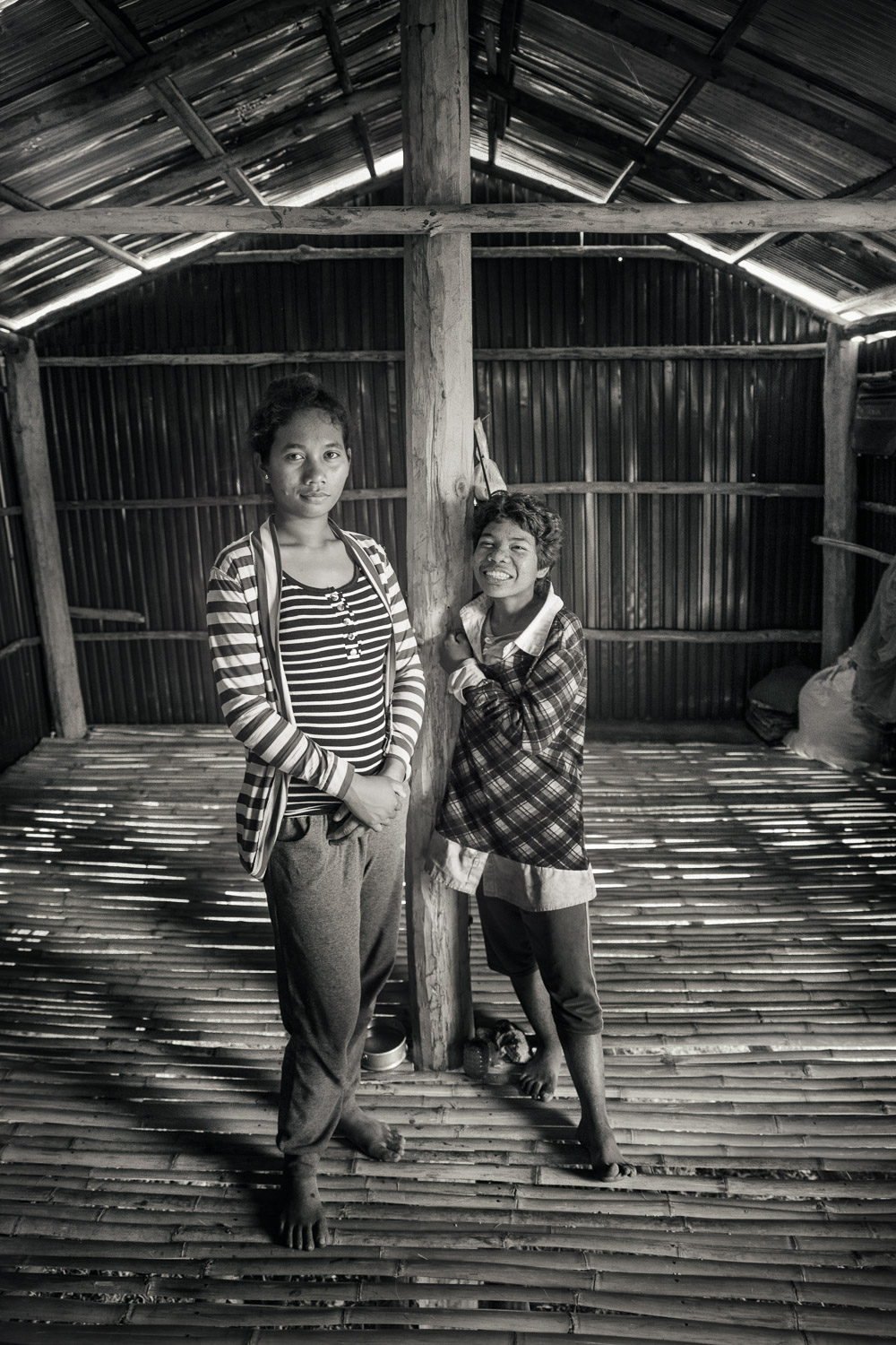  Orng Chea and her sister in the house that DDP helped to construct.  Orng Chea is hard of hearing.  These sisters lost their parents to illness.  When our outreach team met them, while seeking out future participants for the basic education project,