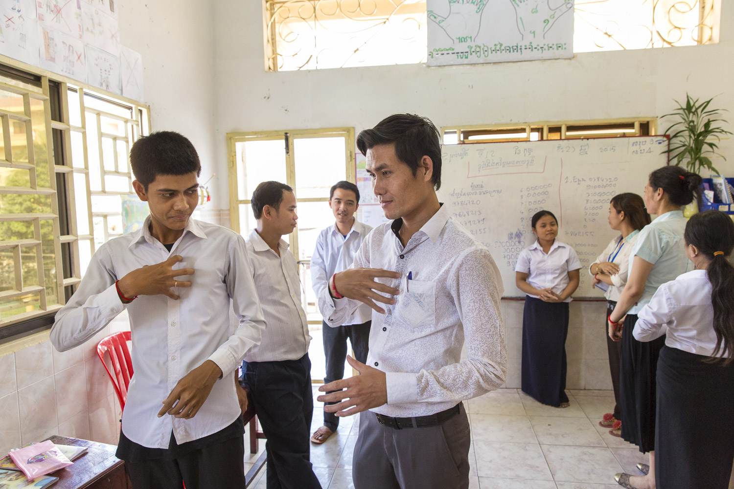  Sopor Lay (middle) a graduate of DDP's program is now a teacher at their Phnom Penh center. 