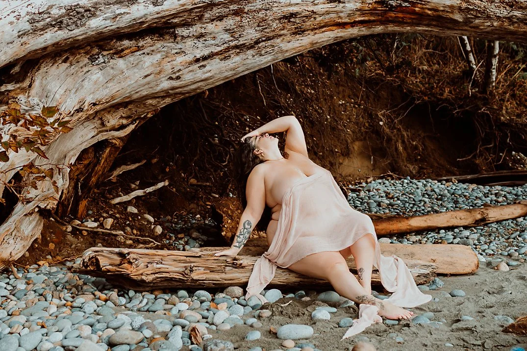 Women sitting on a log, stretching back