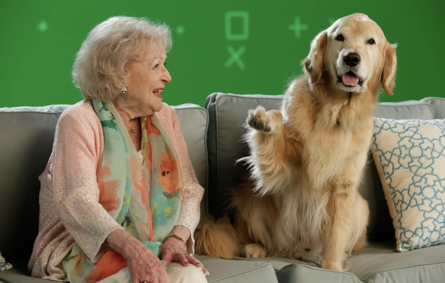 Betty White and dog on sofa