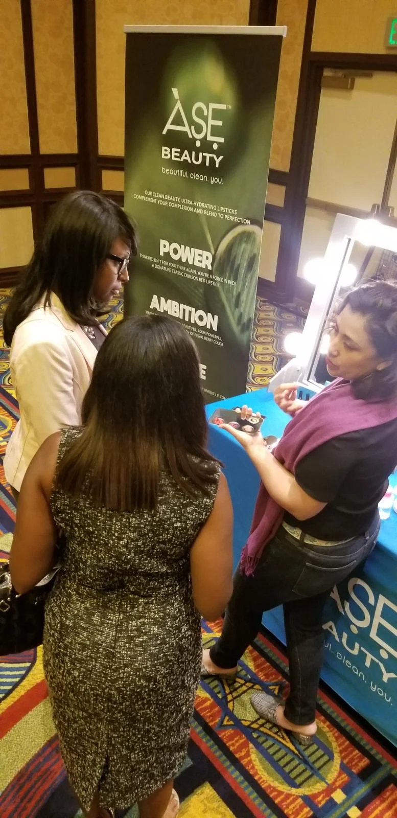 Jack and Jill attendee learning about Clean Beauty with Dr. Nicole Acevedo