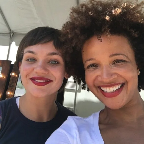 ASE Beauty Chief Branding Officer Nicole Desir (r) with customer at Essence Festival Pop Up store