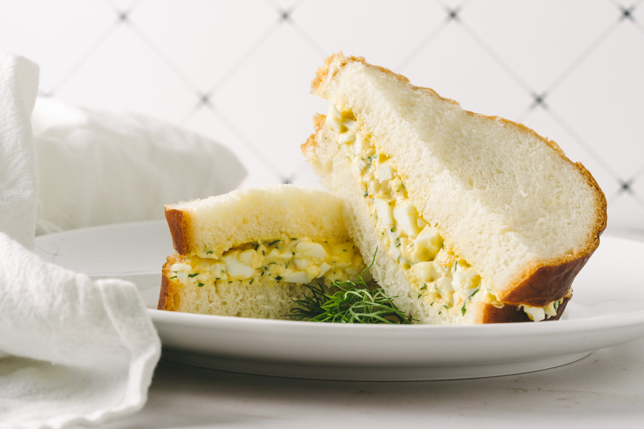  Egg Salad with Dill on sourdough bread from Tartine Bakery shot by Lee Starnes, a food photographer in Saigon, Vietnam. 