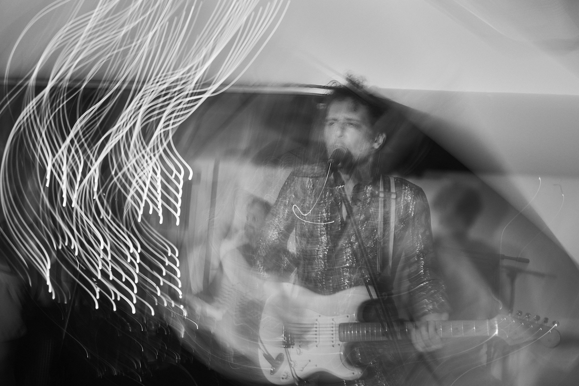 Black and white photo of guitarist and vocalist Jack Briggs of Skeleton Goode. Shot by Lee Starnes, Vietnam travel and product photographer.