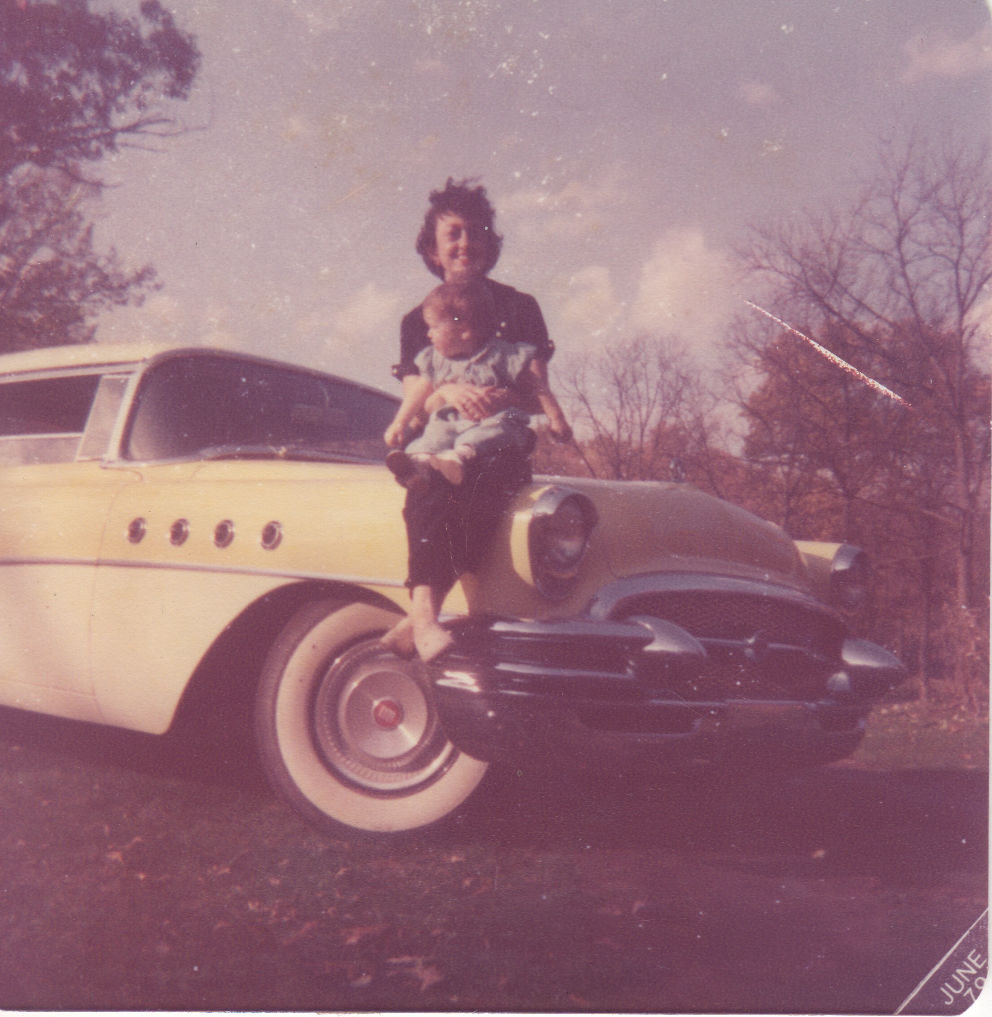 Me Mom and the yellow buick.jpeg